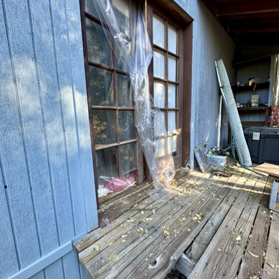Before: old wood-framed door and weathered deck on a Descanso home