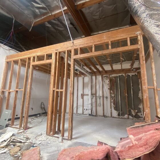 New wood framing among demolition debris in the Miramar warehouse
