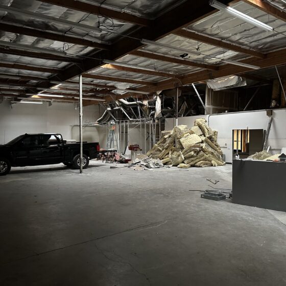 Demolition in progress inside the Miramar warehouse before the gym build-out