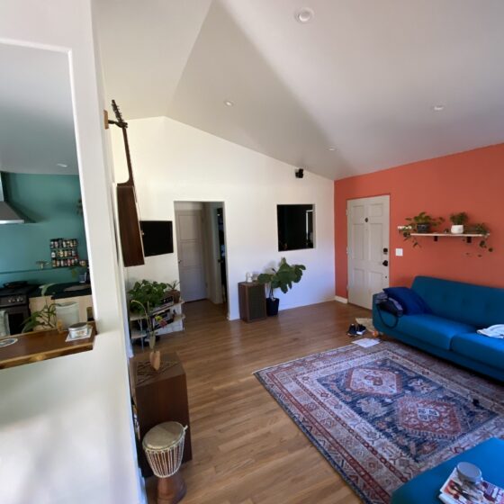 Vaulted ceiling living area in Point Loma opening to the kitchen and entry